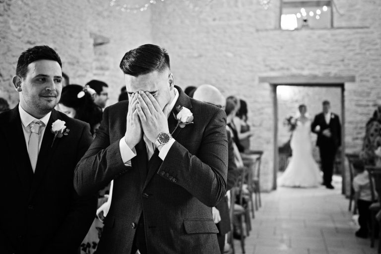 Groom getting emotional as bride is about to walk down the isle.