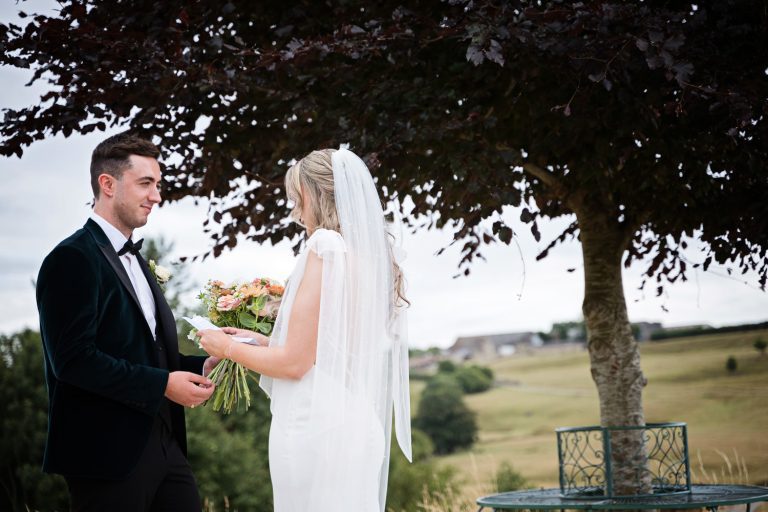 Bride and groom at Kingscote Barn One Tree Hill