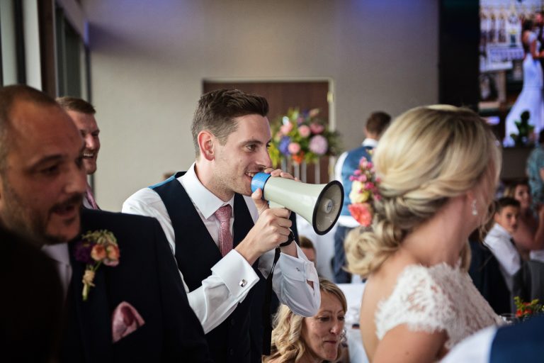 Documentary photo of wedding guests at Tewkesbury Park in the Cotswold Suite.