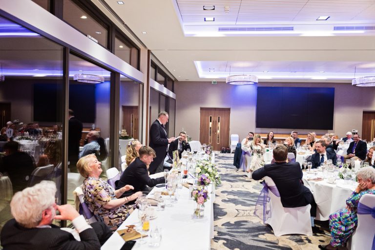 Documentary photo of groom delivering speeches at Tewkesbury Park in the Cotswold Suite.