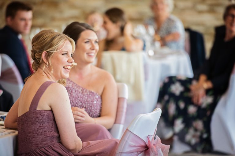 Documentary photo of wedding guests at Tewkesbury Park in the Cotswold Suite.
