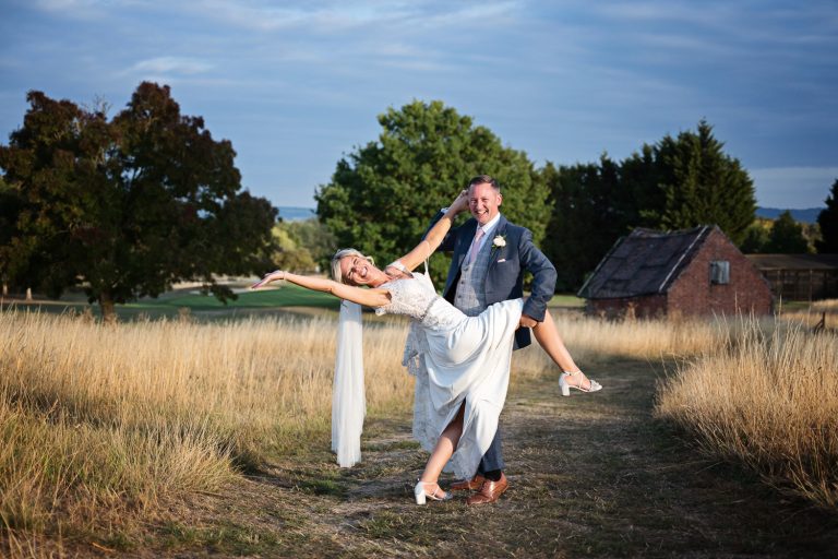 Bride and groom grab a moment during golden hour in the gorgeous grounds at Tewkesbury Park.