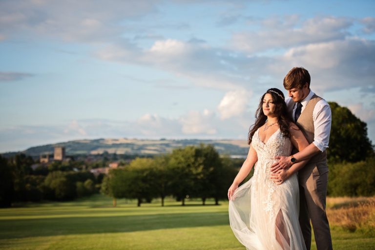 Bride and groom grab a moment during golden hour in the gorgeous grounds at Tewkesbury Park.