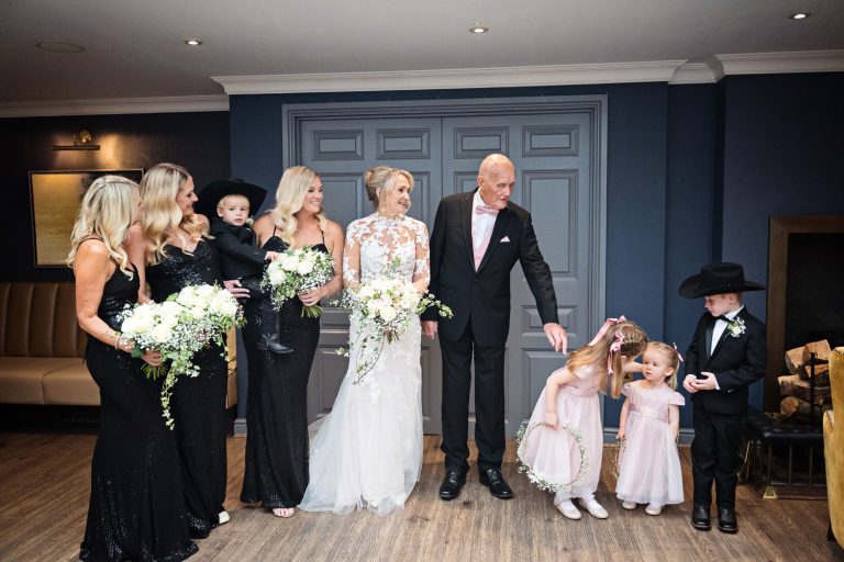 Bridal party get ready to walk down the wedding isle at Tewkesbury Park.